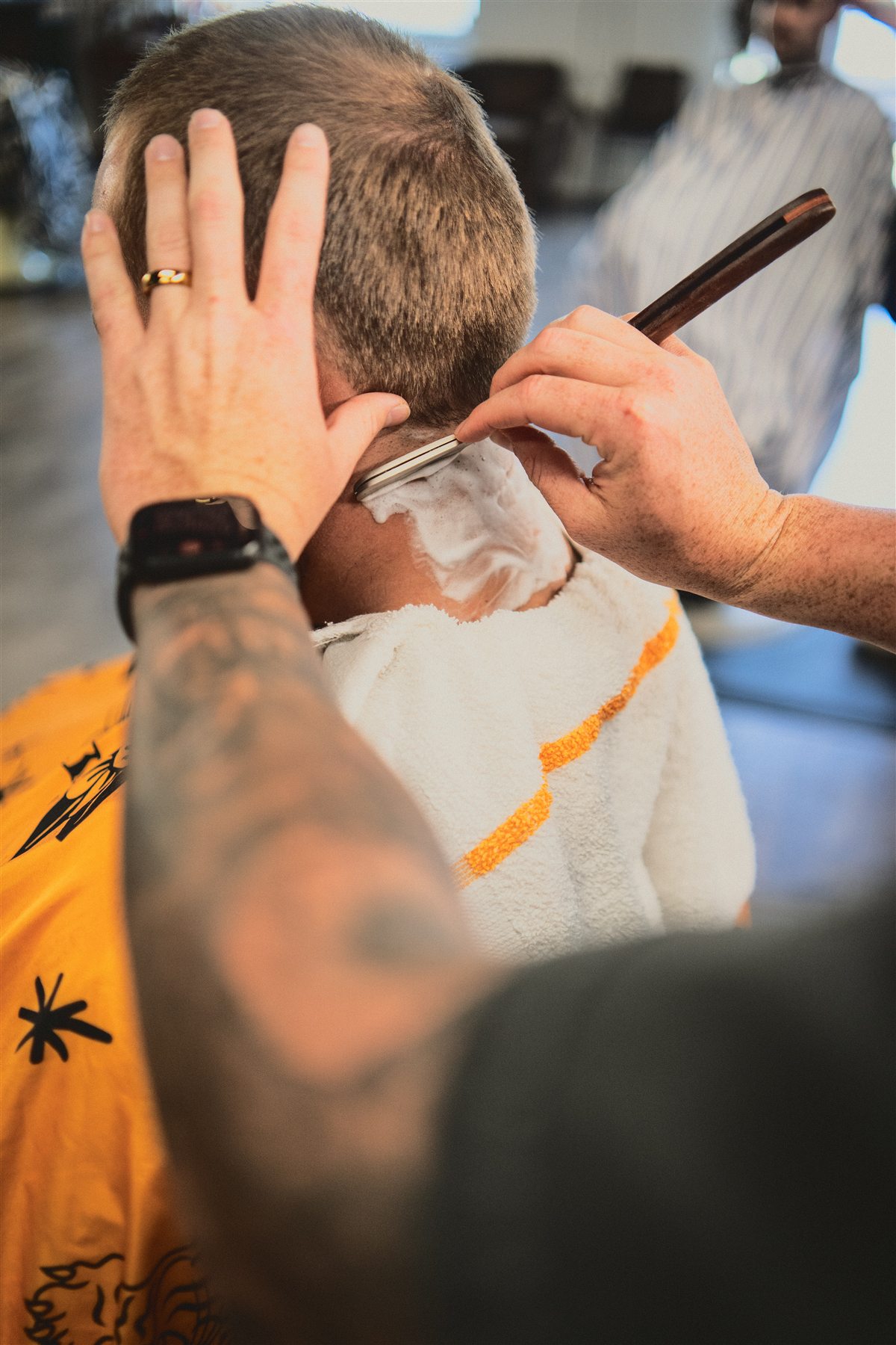 A straight-razor neckline finish in progress